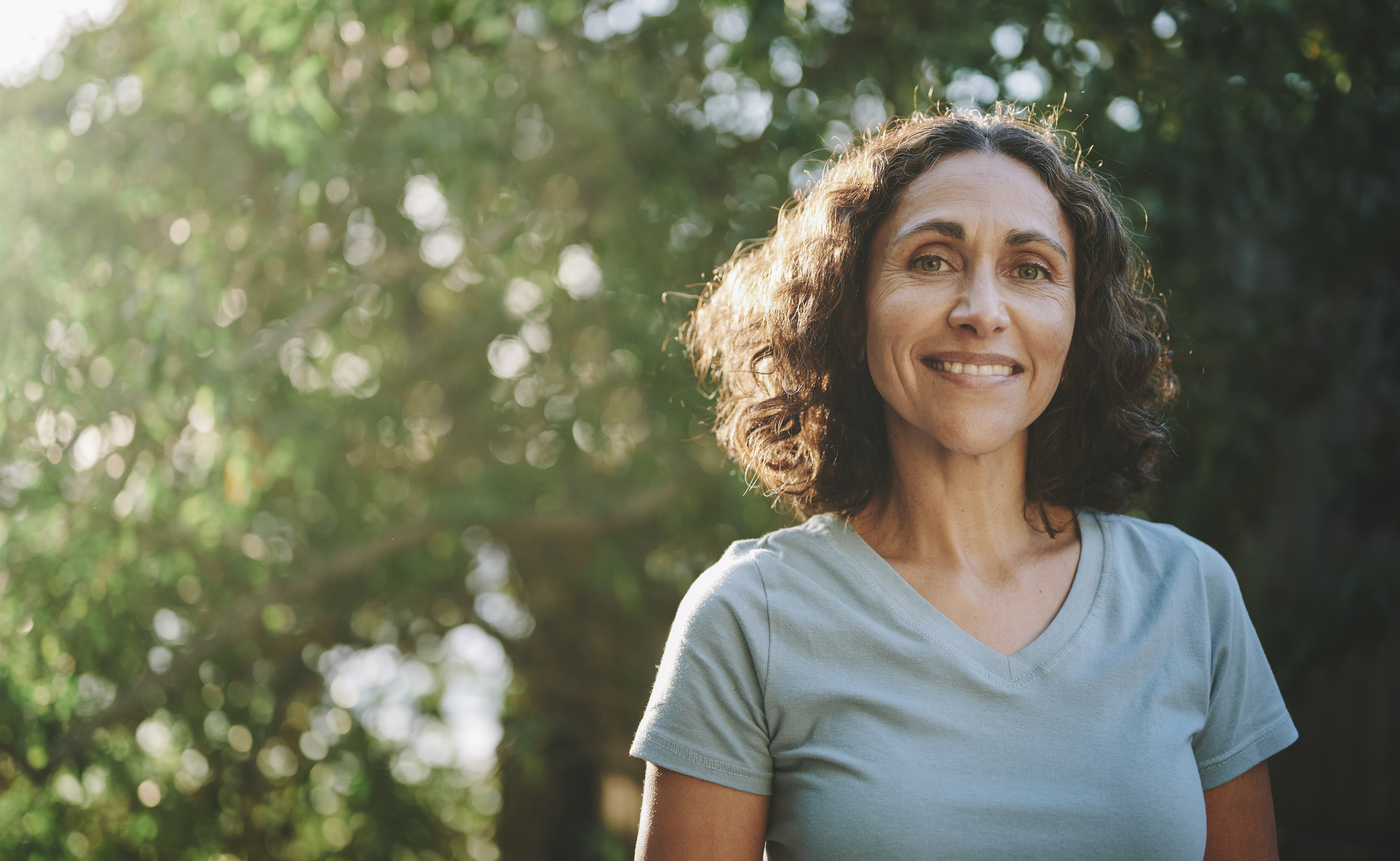 Smiling mature woman standing in a park